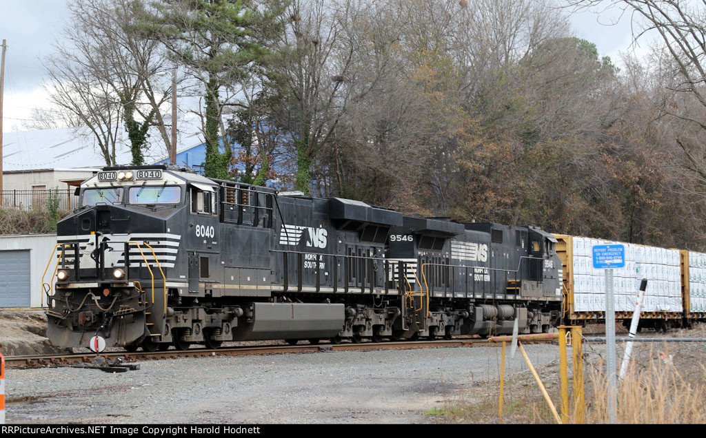 NS 8040 leads train E25 out of the yard